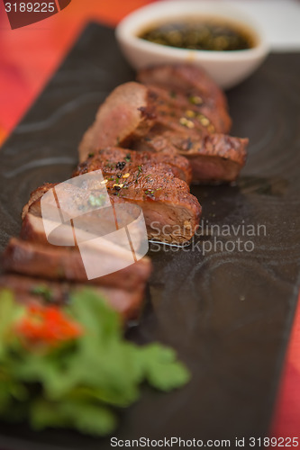 Image of organic fresh ripe roasted beef meat with sauce