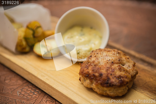Image of Succulent cooked beef burger with potato 