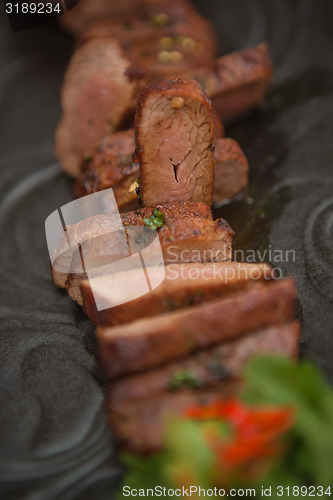 Image of organic fresh ripe roasted beef meat with sauce