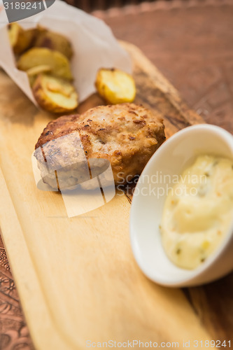 Image of Succulent cooked beef burger with potato 