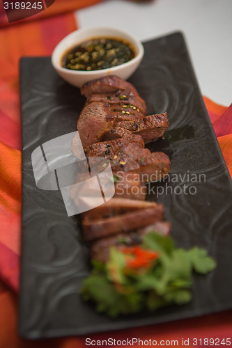 Image of organic fresh ripe roasted beef meat with sauce