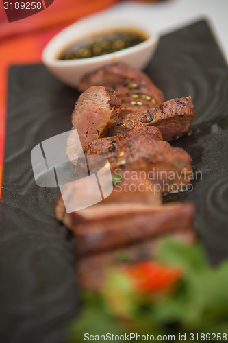 Image of organic fresh ripe roasted beef meat with sauce