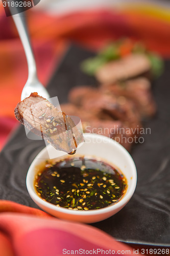 Image of organic fresh ripe roasted beef meat with sauce