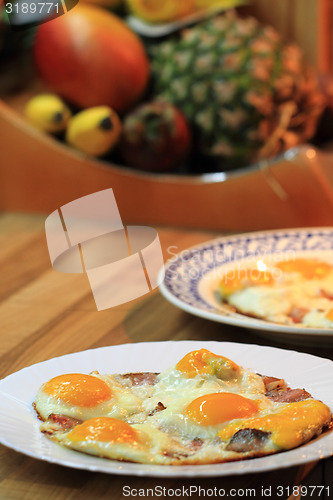 Image of ham and eggs fried 