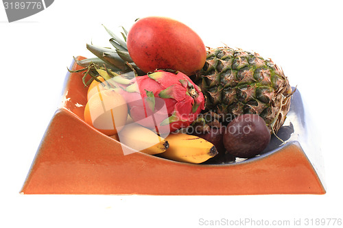 Image of pineapple mango orange banana and dragon fruit