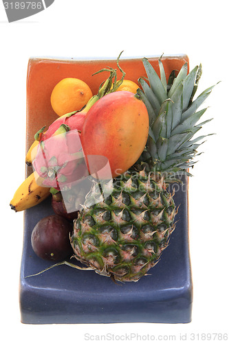 Image of pineapple mango orange banana and dragon fruit