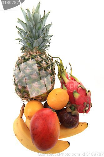 Image of pineapple mango orange banana and dragon fruit