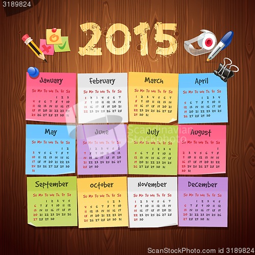 Image of Office Stickers Calendar 2015 calendar on Wooden Background
