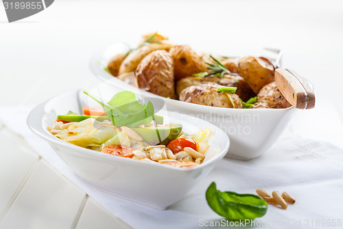 Image of Cabbage salad with avocado and oven potatoes 