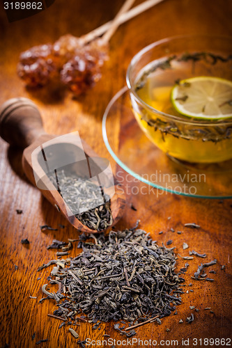 Image of Dry tea on wooden table