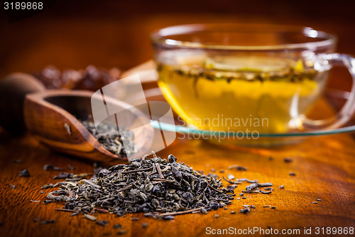 Image of Dry tea on wooden table