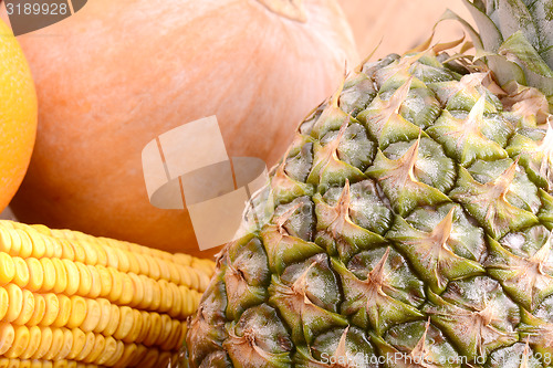 Image of fresh pineapple with corn and pumpkin