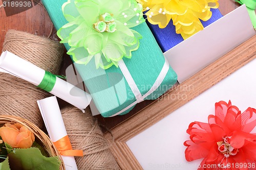 Image of set of gift box, flowers and ribbons