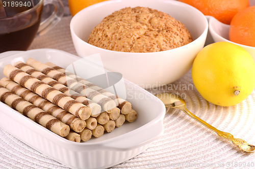 Image of sweet cake on white plate with lemon