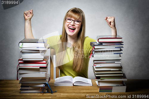 Image of happy student woman with books