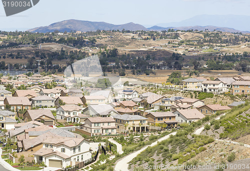 Image of Contemporary Neighborhood and Majestic Clouds