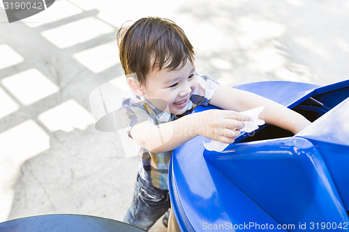 Image of Cute Mixed Race Boy Placing Paper Into Recycle Bin