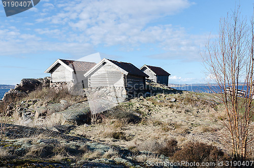 Image of three old boat house