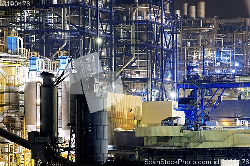 Image of power station at night with smoke