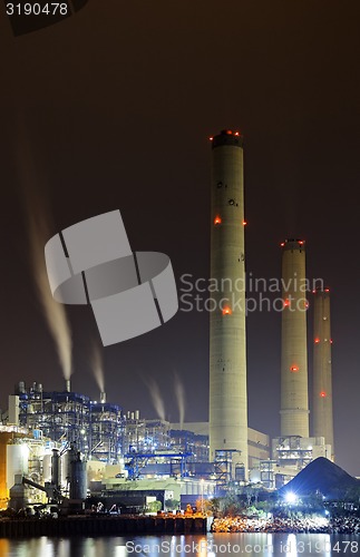 Image of power station at night with smoke