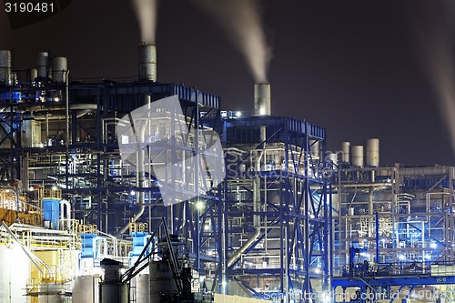 Image of power station at night with smoke