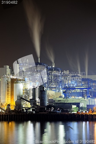 Image of power station at night with smoke