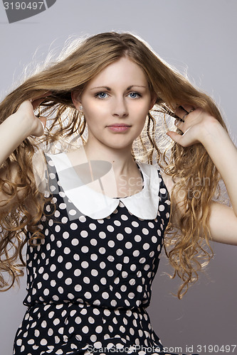 Image of Young long-haired curly blonde woman