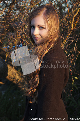 Image of Young long-haired curly blonde woman