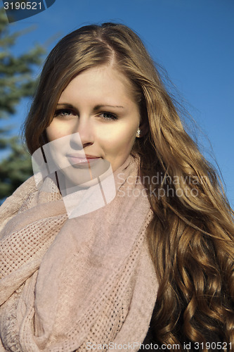 Image of Young long-haired curly blonde woman