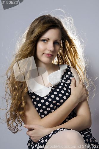 Image of Young long-haired curly blonde woman