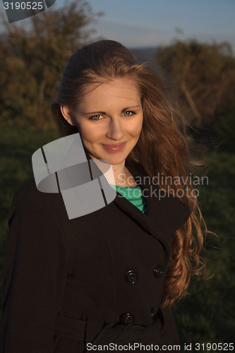 Image of Young long-haired curly blonde woman