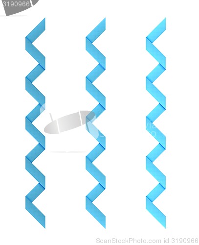 Image of three different blue dotted twisted ribbons on white background