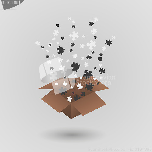 Image of brown paper box and puzzle pieces