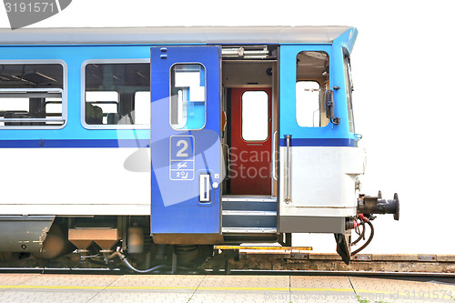 Image of blue train with open door, isolated