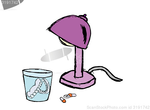 Image of denture, pills and lamp