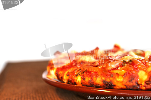 Image of pizza on the brown plate, isolated