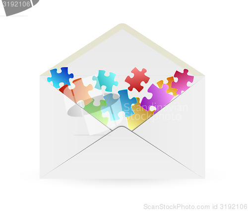 Image of white envelope with puzzle pieces