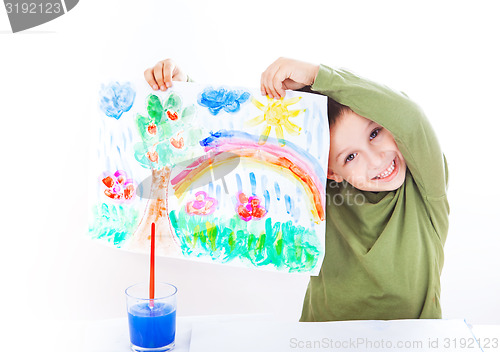 Image of Happy boy presenting his painting