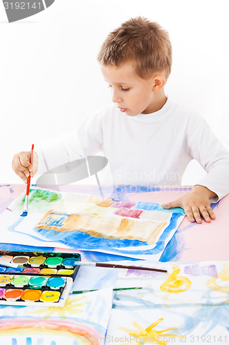 Image of Casual schoolboy painting