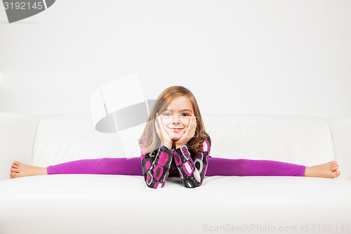 Image of Cute little girl making splits