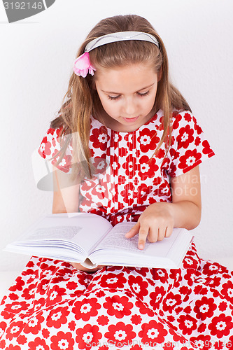 Image of Schoolgirl reading book