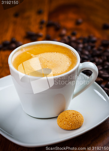 Image of Cup of coffee with beans