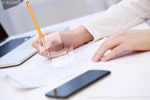 Image of Female hand writing, close up