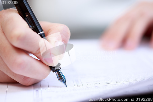 Image of Woman working with documents