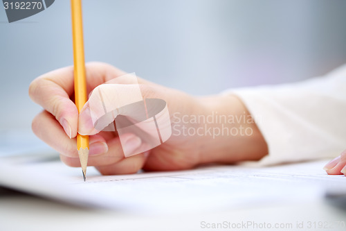 Image of Female hand writing, close up