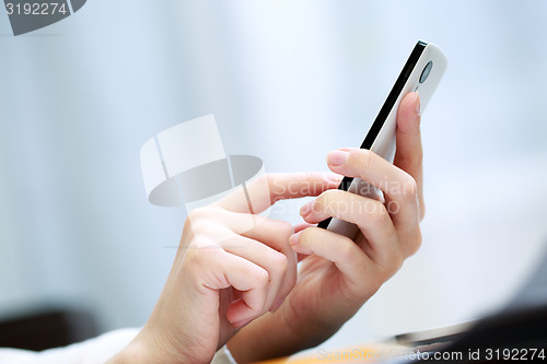 Image of Woman using a mobile phone 