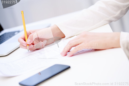 Image of Female hand writing, close up