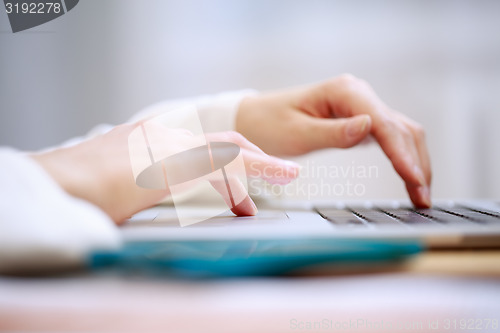 Image of Close-up shot typing on the laptop keyboard