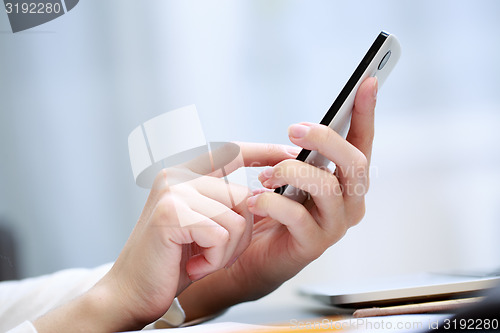 Image of Woman using a mobile phone 