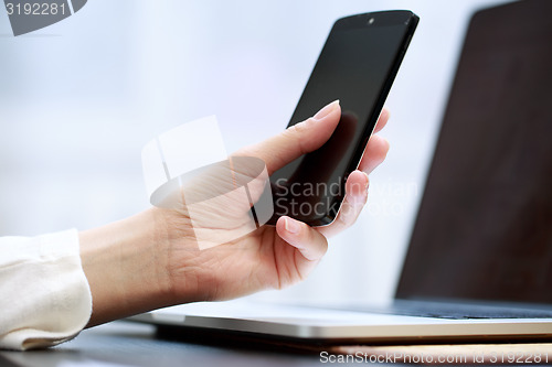 Image of Woman using a mobile phone 